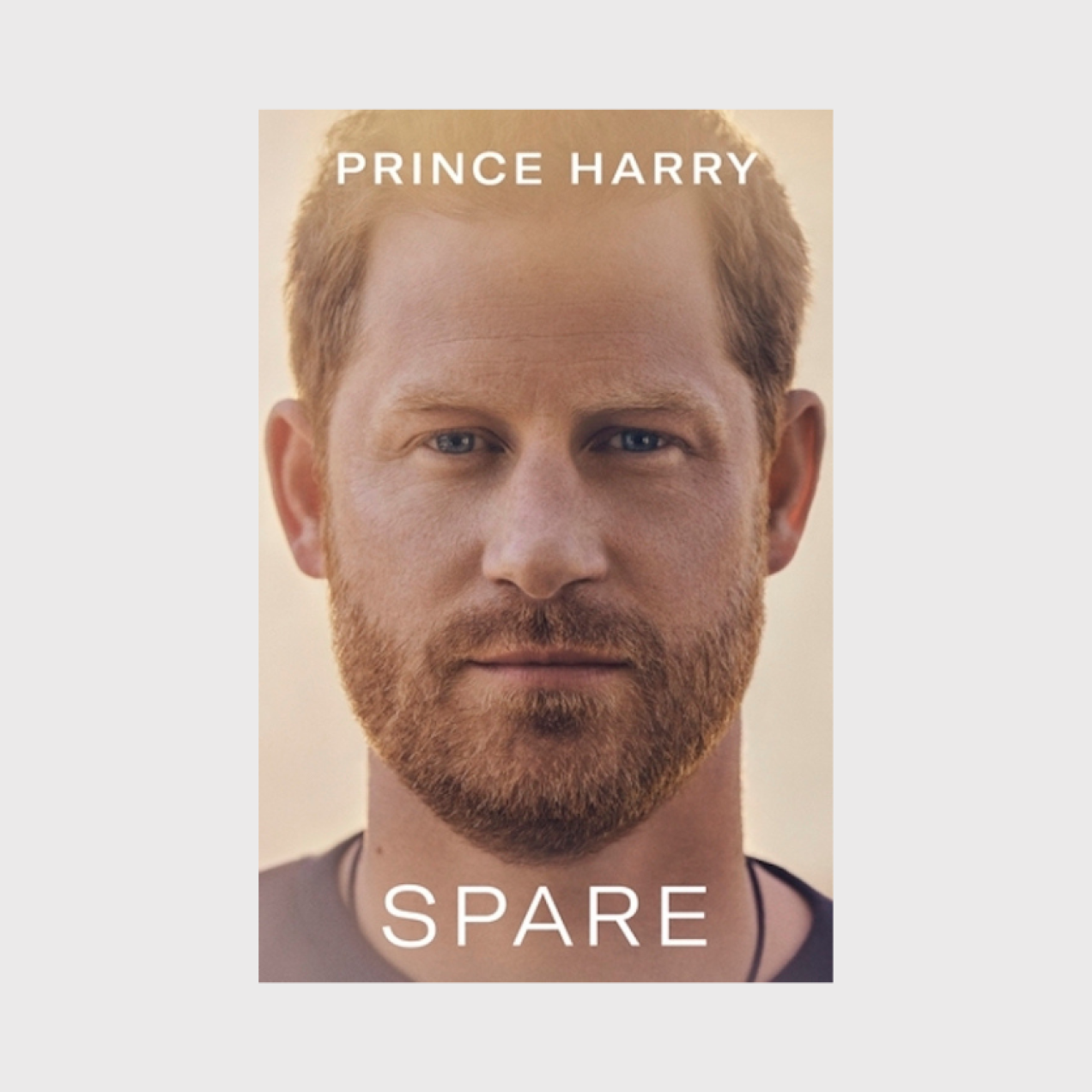 The book jacket of Spare which shows Prince Harry's head looking straight to camera. The words Prince Harry and Spare appear on the top and bottom of the image.